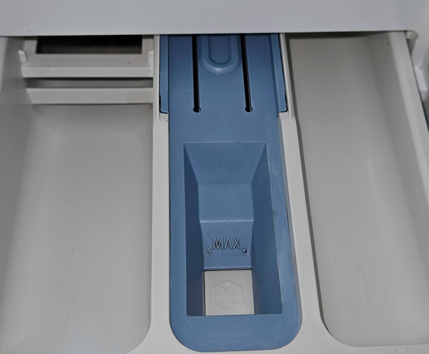 Spotless washing machine detergent drawer after cleaning