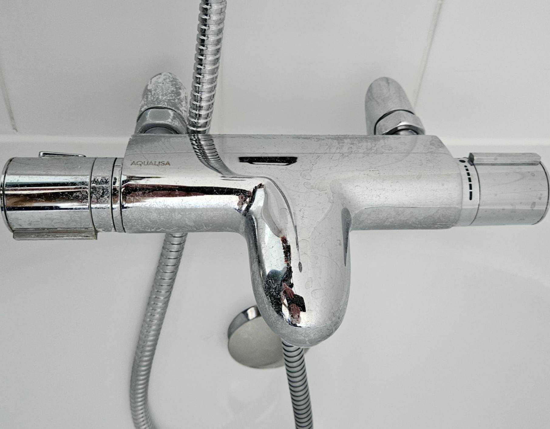 Limescaled bathroom tap before cleaning